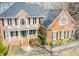 Stunning brick house with balcony, front porch, and a professionally landscaped front yard at 650 Vinings Estates Se Dr, Mableton, GA 30126
