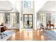 A spacious, light-filled foyer features hardwood floors, white trim and an inviting entry at 650 Vinings Estates Se Dr, Mableton, GA 30126