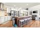 Spacious kitchen with stainless steel appliances, large island, and breakfast bar at 650 Vinings Estates Se Dr, Mableton, GA 30126