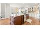 Kitchen with granite countertops, island with breakfast bar, stainless steel appliances, and view to breakfast nook at 650 Vinings Estates Se Dr, Mableton, GA 30126