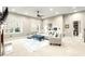Spacious living room features a ceiling fan, neutral color palette, and comfortable seating arrangement at 650 Vinings Estates Se Dr, Mableton, GA 30126