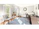Bright office space with natural light, a patterned rug, and elegant furnishings for a comfortable workspace at 650 Vinings Estates Se Dr, Mableton, GA 30126