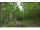 A well-maintained walking trail winds through a lush forest, perfect for recreation at 650 Vinings Estates Se Dr, Mableton, GA 30126