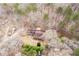 High angle aerial view of the house surrounded by lush green trees at 8951 Brewer Rd, Douglasville, GA 30134