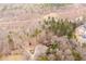 Picturesque aerial shot of home enveloped by trees with a tranquil, secluded ambiance and natural setting at 8951 Brewer Rd, Douglasville, GA 30134