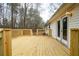 Newly built wooden back deck with doors leading into the house at 8951 Brewer Rd, Douglasville, GA 30134