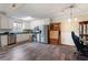 Bright eat-in kitchen features white cabinets, stainless steel appliances and hardwood floors at 8951 Brewer Rd, Douglasville, GA 30134