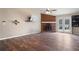 Spacious living room with a charming brick fireplace and sliding glass doors to the deck at 8951 Brewer Rd, Douglasville, GA 30134