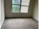 Bedroom featuring neutral carpet and a double window at 312 Lauren Dr, Fairburn, GA 30213