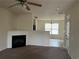Spacious living room featuring a fireplace, neutral walls, and lots of natural light at 312 Lauren Dr, Fairburn, GA 30213