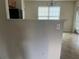 Open-concept kitchen/dining area with neutral walls, tile floor and lots of light from windows and sliding door at 312 Lauren Dr, Fairburn, GA 30213