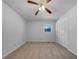 Spacious bedroom features carpet floors, fan and a closet, offering ample storage at 6691 Birch Dr, Winston, GA 30187