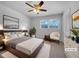 A serene main bedroom featuring a comfortable bed, soft lighting, and tasteful decor at 6691 Birch Dr, Winston, GA 30187