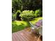 Inviting backyard featuring a wooden deck and lush landscaping, perfect for outdoor relaxation and entertainment at 2825 Parnell Springs Ct, Cumming, GA 30040