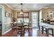 Charming dining space with wood floors, a view into the kitchen, and lots of natural light at 2825 Parnell Springs Ct, Cumming, GA 30040