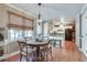 Sunlit dining area featuring a round table and a view into the kitchen space at 2825 Parnell Springs Ct, Cumming, GA 30040