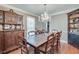 Elegant dining room with hardwood floors, chandelier, and antique furniture at 2825 Parnell Springs Ct, Cumming, GA 30040