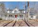 Charming two-story home with a welcoming front porch and beautiful landscaping at 2825 Parnell Springs Ct, Cumming, GA 30040