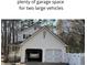 Spacious two-car garage providing ample room for parking and storage, enhancing the property's functionality at 2825 Parnell Springs Ct, Cumming, GA 30040