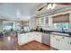Charming kitchen with white cabinets, granite counters, and stainless steel appliances at 2825 Parnell Springs Ct, Cumming, GA 30040