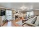Bright and airy living room with a fireplace, wood floors, and neutral decor at 2825 Parnell Springs Ct, Cumming, GA 30040
