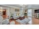 Open living room featuring a comfortable sofa and hardwood floors at 2825 Parnell Springs Ct, Cumming, GA 30040
