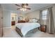 Comfortable main bedroom with carpet, neutral colors, and an ensuite bathroom at 2825 Parnell Springs Ct, Cumming, GA 30040