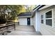 A deck leads to a blue back door on the home's exterior at 8083 Highway 166, Douglasville, GA 30135