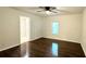 Bedroom with ceiling fan, window, and hardwood flooring at 8083 Highway 166, Douglasville, GA 30135