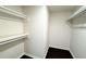 Walk-in closet with shelving for organization and dark wood floors at 8083 Highway 166, Douglasville, GA 30135