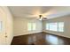 Light and airy living room with dark floors and multiple windows at 8083 Highway 166, Douglasville, GA 30135