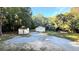 Gravel drive leads to a pair of outbuildings at 8083 Highway 166, Douglasville, GA 30135