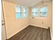 Versatile room with hardwood flooring and lots of windows at 8083 Highway 166, Douglasville, GA 30135