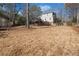 Spacious backyard featuring a deck and tiered yard, perfect for outdoor entertaining and enjoying nature at 1835 Tree Top Way, Marietta, GA 30062
