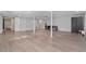 Finished basement offers open space with light-colored flooring and white support columns, ready for recreation at 1835 Tree Top Way, Marietta, GA 30062