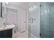 Modern bathroom boasts glass-enclosed shower, marble floors, and sleek vanity, creating a spa-like atmosphere at 1835 Tree Top Way, Marietta, GA 30062