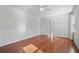Spacious bedroom with hardwood floors, a ceiling fan, and natural light at 1835 Tree Top Way, Marietta, GA 30062