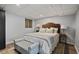 Charming bedroom features neutral decor, tufted headboard, bamboo art, and new floors for a tranquil retreat at 1835 Tree Top Way, Marietta, GA 30062