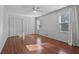 Bright bedroom featuring hardwood floors, a ceiling fan, and large double closets at 1835 Tree Top Way, Marietta, GA 30062