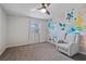 Charming bedroom with accent wall, cozy chair, and bright natural light at 1835 Tree Top Way, Marietta, GA 30062