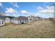 Large backyard showcases ample space for recreation, framed by a clear blue sky, perfect for outdoor activities at 4768 Score Ct, Snellville, GA 30039