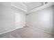 Spacious bedroom with a tray ceiling and two doors at 4768 Score Ct, Snellville, GA 30039