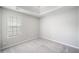 Clean bedroom with window and a trey ceiling at 4768 Score Ct, Snellville, GA 30039