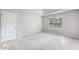 Bright bedroom with tray ceiling, a door and a large window at 4768 Score Ct, Snellville, GA 30039