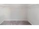 Empty walk-in closet with shelves and carpet, ready to be organized at 4768 Score Ct, Snellville, GA 30039
