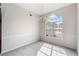 Dining room with large window and view to the neighborhood at 4768 Score Ct, Snellville, GA 30039