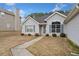 Inviting single-Gathering home with a well-manicured lawn and a welcoming front entrance at 4768 Score Ct, Snellville, GA 30039