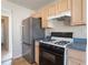 Modern kitchen appliances including a refrigerator and gas range at 4768 Score Ct, Snellville, GA 30039