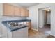 Functional kitchen with stainless steel sink, and adjacent door to the rest of the house at 4768 Score Ct, Snellville, GA 30039