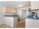Well-lit kitchen featuring a gas range, plentiful cabinet space and tiled floors at 4768 Score Ct, Snellville, GA 30039